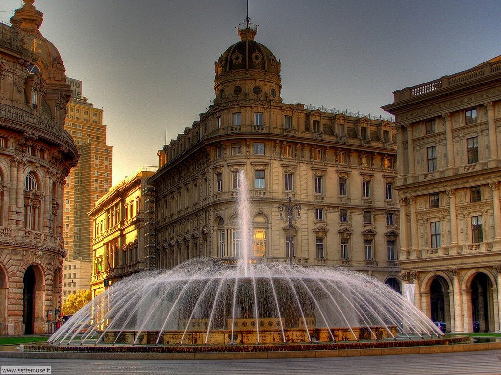 A fountain in the middle of a city.