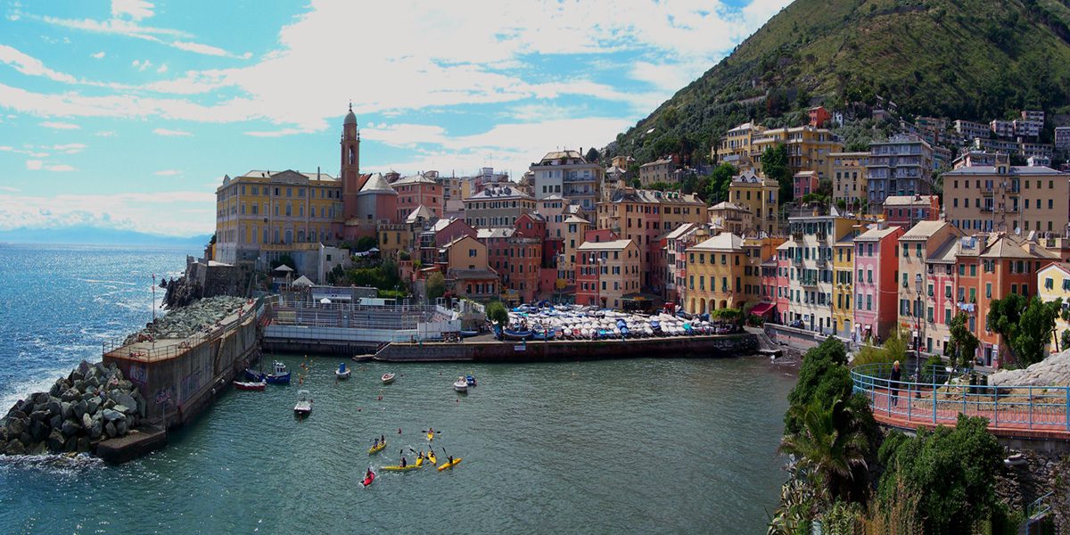 A view of the city from above, with boats in the water.